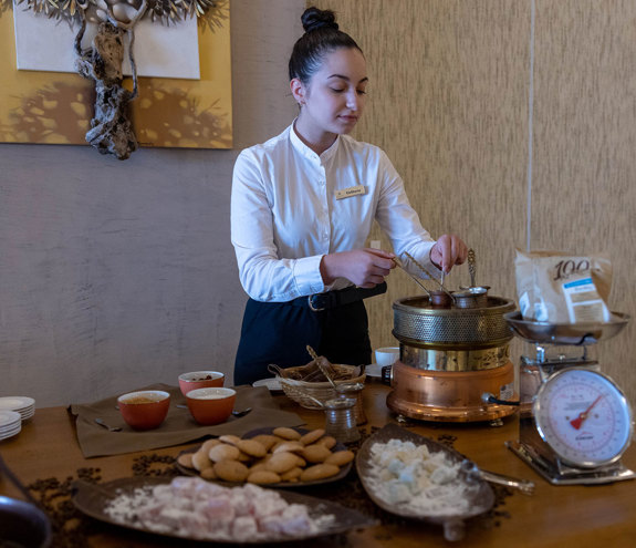 Elia Restaurant waitress making coffee