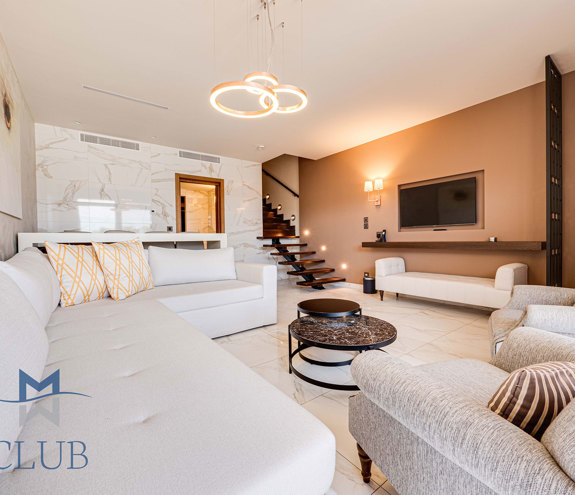 Duplex Sea View Private Pool Suite living room sofa, armchairs and amenities