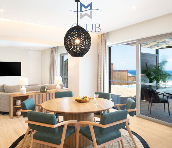Miraggio Duplex Private Pool Suite table and chairs and the living room in the background