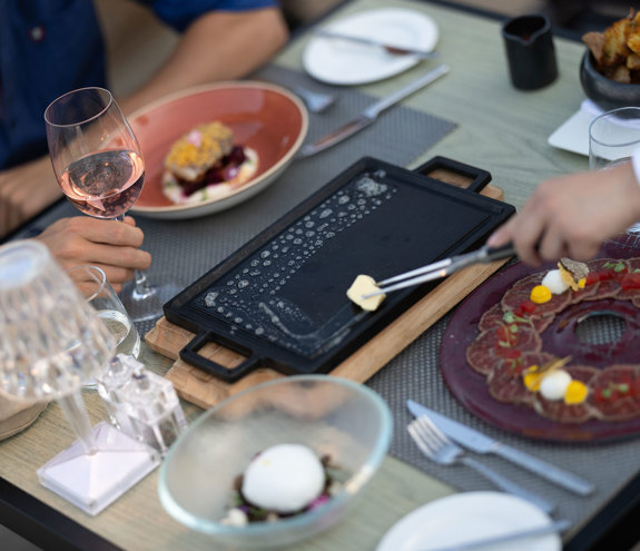 Sommelier's Restaurant table with multiple dishes on