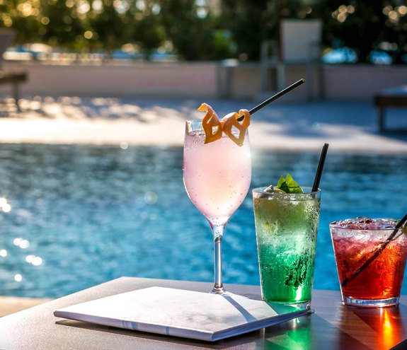 Oasis Pool Bar drinks with the pool in the background
